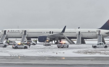 Delta passengers evacuate flight on emergency slides during aborted takeoff