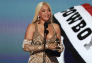 Beyoncé honors first responders in Grammys speech for album of the year win