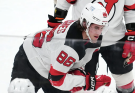 Devils star Jack Hughes out for season following hard crash into boards