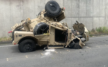 Two injured after military vehicle crashes over highway retaining wall, plunges 30 feet onto road below